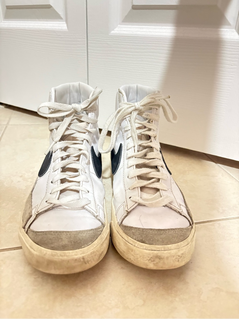 Nike Women's White High-Top Sneakers with Black Swoosh